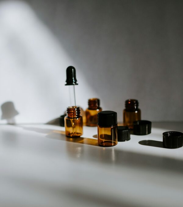 Curated lineup of professional post-transplant hair recovery products in amber bottles