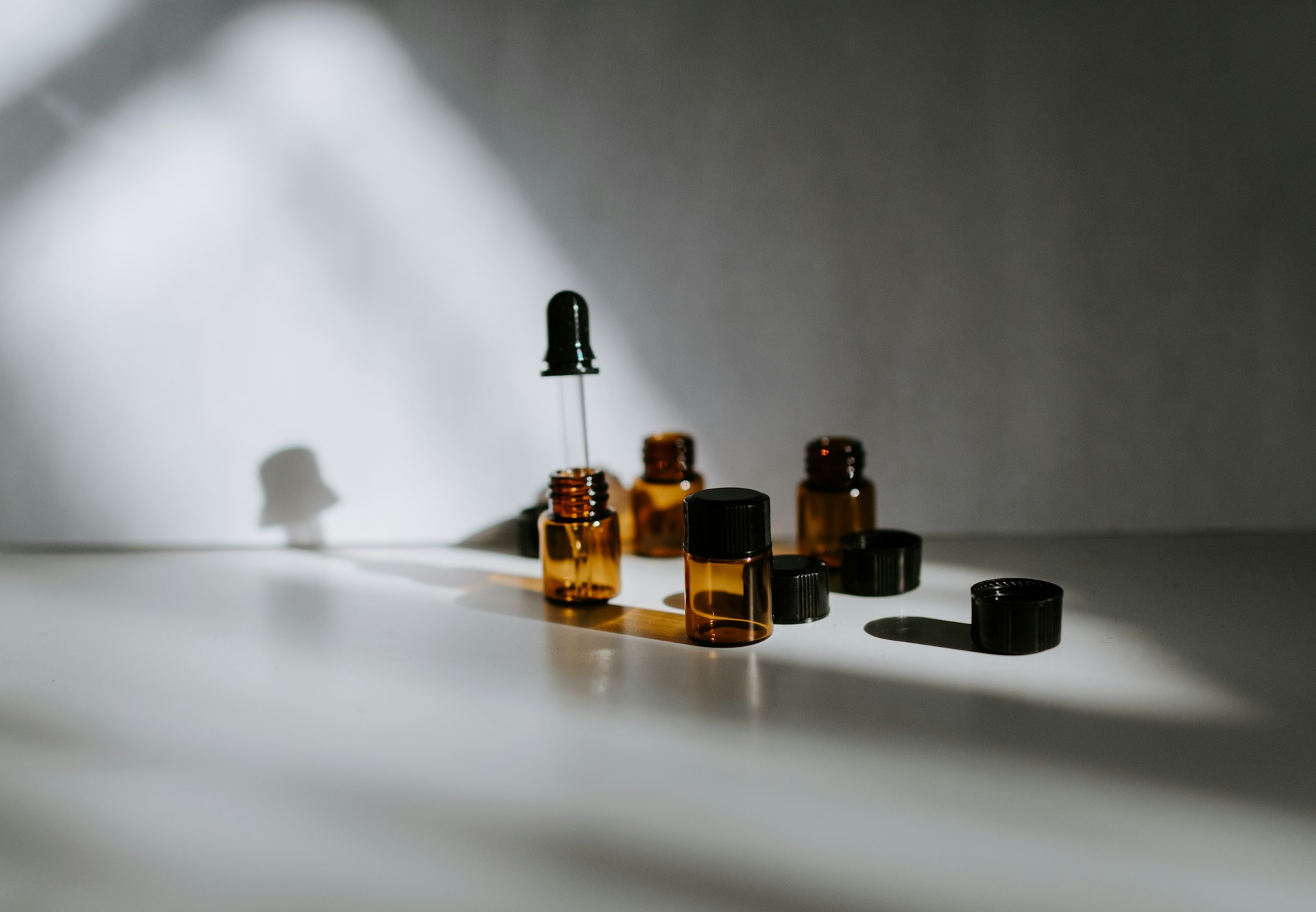 Curated lineup of professional post-transplant hair recovery products in amber bottles