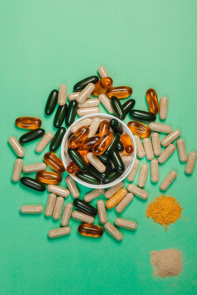 Hair health supplements and nutrient capsules representing ingredients that support reduced hair loss
