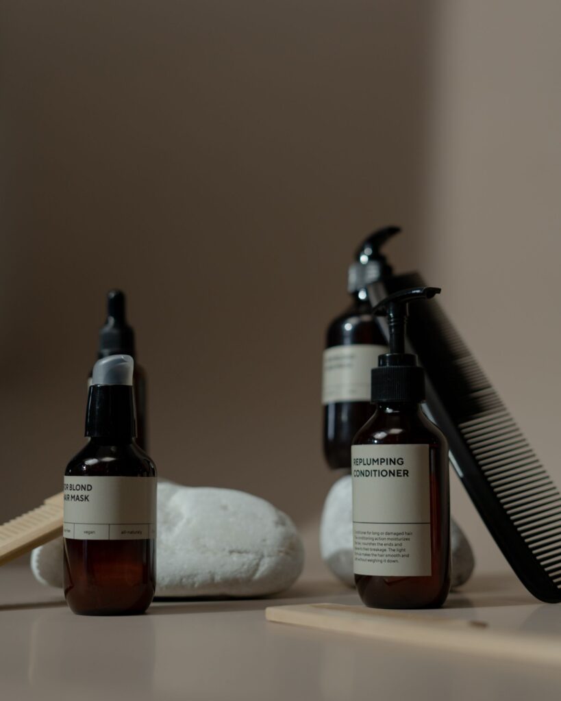 Hair care product bottles and a comb for a post-transplant product routine
